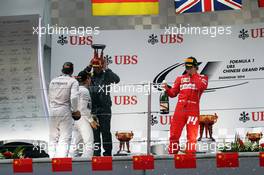 Fernando Alonso (ESP) Ferrari celebrates his third position on the podium. 20.04.2014. Formula 1 World Championship, Rd 4, Chinese Grand Prix, Shanghai, China, Race Day.