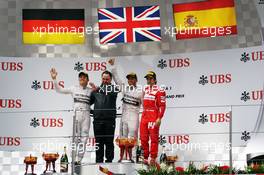The podium (L to R): Nico Rosberg (GER) Mercedes AMG F1, second; Ron Meadows (GBR) Mercedes GP Team Manager; Lewis Hamilton (GBR) Mercedes AMG F1, race winner; Fernando Alonso (ESP) Ferrari, third. 20.04.2014. Formula 1 World Championship, Rd 4, Chinese Grand Prix, Shanghai, China, Race Day.