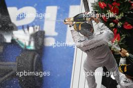 Race winner Lewis Hamilton (GBR) Mercedes AMG F1 celebrates on the podium with team mate Nico Rosberg (GER) Mercedes AMG F1. 20.04.2014. Formula 1 World Championship, Rd 4, Chinese Grand Prix, Shanghai, China, Race Day.
