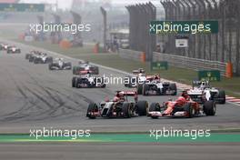 Kimi Raikkonen (FIN), Scuderia Ferrari and Romain Grosjean (FRA), Lotus F1 Team  20.04.2014. Formula 1 World Championship, Rd 4, Chinese Grand Prix, Shanghai, China, Race Day.
