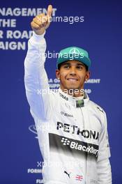 Lewis Hamilton (GBR) Mercedes AMG F1 celebrates his pole position in parc ferme. 19.04.2014. Formula 1 World Championship, Rd 4, Chinese Grand Prix, Shanghai, China, Qualifying Day.