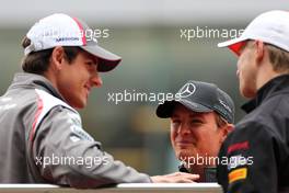 Nico Rosberg (GER), Mercedes AMG F1 Team and Adrian Sutil (GER), Sauber F1 Team  20.04.2014. Formula 1 World Championship, Rd 4, Chinese Grand Prix, Shanghai, China, Race Day.