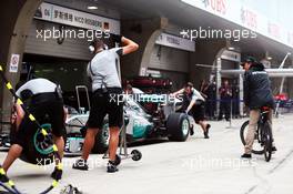 Nico Rosberg (GER) Mercedes AMG F1 on a Smart bike, watches pit stops. 17.04.2014. Formula 1 World Championship, Rd 4, Chinese Grand Prix, Shanghai, China, Preparation Day.