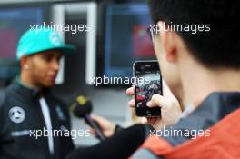 Lewis Hamilton (GBR) Mercedes AMG F1 with the media. 17.04.2014. Formula 1 World Championship, Rd 4, Chinese Grand Prix, Shanghai, China, Preparation Day.
