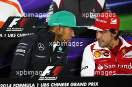 (L to R): Lewis Hamilton (GBR) Mercedes AMG F1 and Fernando Alonso (ESP) Ferrari in the FIA Press Conference. 17.04.2014. Formula 1 World Championship, Rd 4, Chinese Grand Prix, Shanghai, China, Preparation Day.