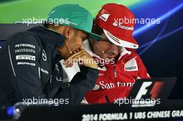 (L to R): Lewis Hamilton (GBR) Mercedes AMG F1 and Fernando Alonso (ESP) Ferrari in the FIA Press Conference. 17.04.2014. Formula 1 World Championship, Rd 4, Chinese Grand Prix, Shanghai, China, Preparation Day.