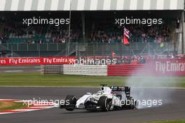 Felipe Massa (BRA) Williams FW36 with punctured rear wheel and rear suspension damage. 06.07.2014. Formula 1 World Championship, Rd 9, British Grand Prix, Silverstone, England, Race Day.