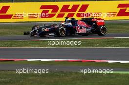 Jean-Eric Vergne (FRA) Scuderia Toro Rosso STR9 and Adrian Sutil (GER) Sauber C33 battle for position. 06.07.2014. Formula 1 World Championship, Rd 9, British Grand Prix, Silverstone, England, Race Day.