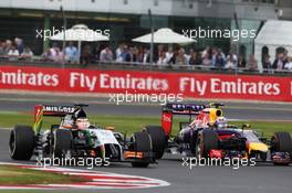 (L to R): Nico Hulkenberg (GER) Sahara Force India F1 VJM07 with Daniel Ricciardo (AUS) Red Bull Racing RB10. 06.07.2014. Formula 1 World Championship, Rd 9, British Grand Prix, Silverstone, England, Race Day.