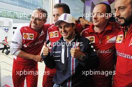 Felipe Massa (BRA) Williams celebrates his 200th GP with members of the Ferrari team. 05.07.2014. Formula 1 World Championship, Rd 9, British Grand Prix, Silverstone, England, Qualifying Day.