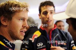 (L to R): Sebastian Vettel (GER) Red Bull Racing with Daniel Ricciardo (AUS) Red Bull Racing. 05.07.2014. Formula 1 World Championship, Rd 9, British Grand Prix, Silverstone, England, Qualifying Day.