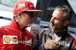 (L to R): Kimi Raikkonen (FIN) Ferrari with Beat Zehnder (SUI) Sauber F1 Team Manager. 05.07.2014. Formula 1 World Championship, Rd 9, British Grand Prix, Silverstone, England, Qualifying Day.