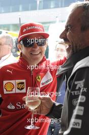 (L to R):Kimi Raikkonen (FIN) Ferrari with Beat Zehnder (SUI) Sauber F1 Team Manager. 05.07.2014. Formula 1 World Championship, Rd 9, British Grand Prix, Silverstone, England, Qualifying Day.