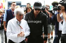 (L to R): Bernie Ecclestone (GBR) with Jude Law (GBR) Actor. 06.07.2014. Formula 1 World Championship, Rd 9, British Grand Prix, Silverstone, England, Race Day.