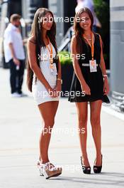 Two young women in the paddock. 25.07.2014. Formula 1 World Championship, Rd 11, Hungarian Grand Prix, Budapest, Hungary, Practice Day.