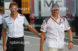 (L to R): Jenson Button (GBR) McLaren with Adrian Sutil (GER) Sauber. 25.07.2014. Formula 1 World Championship, Rd 11, Hungarian Grand Prix, Budapest, Hungary, Practice Day.