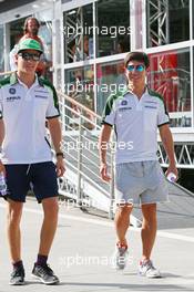 (L to R): Marcus Ericsson (SWE) Caterham with team mate Kamui Kobayashi (JPN) Caterham. 25.07.2014. Formula 1 World Championship, Rd 11, Hungarian Grand Prix, Budapest, Hungary, Practice Day.