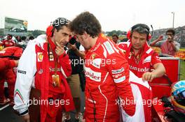 Fernando Alonso (ESP) Ferrari with Andrea Stella (ITA) Ferrari Race Engineer on the grid. 27.07.2014. Formula 1 World Championship, Rd 11, Hungarian Grand Prix, Budapest, Hungary, Race Day.