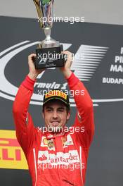 Fernando Alonso (ESP) Ferrari celebrates his second position on the podium. 27.07.2014. Formula 1 World Championship, Rd 11, Hungarian Grand Prix, Budapest, Hungary, Race Day.