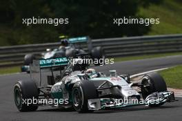 Lewis Hamilton (GBR) Mercedes AMG F1 leads Nico Rosberg (GER) Mercedes AMG F1 W05. 27.07.2014. Formula 1 World Championship, Rd 11, Hungarian Grand Prix, Budapest, Hungary, Race Day.