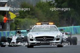 Nico Rosberg (GER) Mercedes AMG F1 W05 leads behind the FIA Safety Car. 27.07.2014. Formula 1 World Championship, Rd 11, Hungarian Grand Prix, Budapest, Hungary, Race Day.