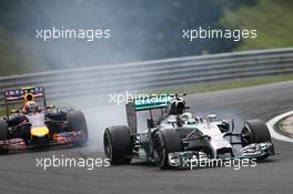 Lewis Hamilton (GBR) Mercedes AMG F1 W05 and Daniel Ricciardo (AUS) Red Bull Racing RB10. 27.07.2014. Formula 1 World Championship, Rd 11, Hungarian Grand Prix, Budapest, Hungary, Race Day.