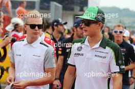 (L to R): Kevin Magnussen (DEN) McLaren and Marcus Ericsson (SWE) Caterham on the drivers parade. 27.07.2014. Formula 1 World Championship, Rd 11, Hungarian Grand Prix, Budapest, Hungary, Race Day.