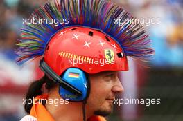 A marshal with a mohican Michael Schumacher (GER) themed  helmet. 27.07.2014. Formula 1 World Championship, Rd 11, Hungarian Grand Prix, Budapest, Hungary, Race Day.