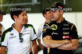 (L to R): Kamui Kobayashi (JPN) Caterham and Pastor Maldonado (VEN) Lotus F1 Team on the drivers parade. 27.07.2014. Formula 1 World Championship, Rd 11, Hungarian Grand Prix, Budapest, Hungary, Race Day.