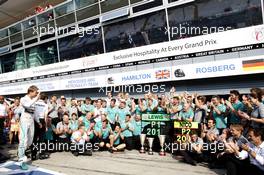 Nico Rosberg (GER) Mercedes AMG F1 celebrates his second position with Paddy Lowe (GBR) Mercedes AMG F1 Executive Director (Technical) and the team. 07.09.2014. Formula 1 World Championship, Rd 13, Italian Grand Prix, Monza, Italy, Race Day.