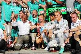 Race winner Lewis Hamilton (GBR) Mercedes AMG F1 celebrates with his step mother Linda Hamilton, father Anthony Hamilton (GBR), team mate Nico Rosberg (GER) Mercedes AMG F1, and the team. 07.09.2014. Formula 1 World Championship, Rd 13, Italian Grand Prix, Monza, Italy, Race Day.