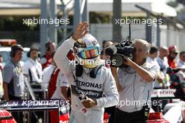 Lewis Hamilton (GBR) Mercedes AMG F1 celebrates his pole position in parc ferme. 06.09.2014. Formula 1 World Championship, Rd 13, Italian Grand Prix, Monza, Italy, Qualifying Day.