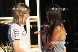 (L to R): Susie Wolff (GBR) Williams Development Driver with Gabriele Tarkanyi, wife of Pastor Maldonado (VEN) Lotus F1 Team, and their daughter Victoria. 06.09.2014. Formula 1 World Championship, Rd 13, Italian Grand Prix, Monza, Italy, Qualifying Day.