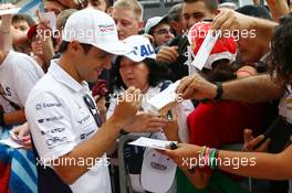 Felipe Massa (BRA) Williams signs autographs for the fans. 04.09.2014. Formula 1 World Championship, Rd 13, Italian Grand Prix, Monza, Italy, Preparation Day.