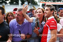 Jules Bianchi (FRA) Marussia F1 Team with fans. 04.09.2014. Formula 1 World Championship, Rd 13, Italian Grand Prix, Monza, Italy, Preparation Day.