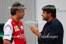 (L to R): Marco Mattiacci (ITA) Ferrari Team Principal with Luis Garcia Abad (ESP) Driver Manager of Fernando Alonso (ESP) Ferrari. 03.10.2014. Formula 1 World Championship, Rd 15, Japanese Grand Prix, Suzuka, Japan, Practice Day.