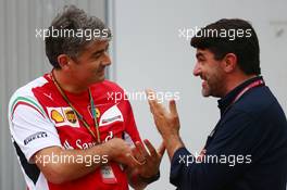(L to R): Marco Mattiacci (ITA) Ferrari Team Principal with Luis Garcia Abad (ESP) Driver Manager of Fernando Alonso (ESP) Ferrari. 03.10.2014. Formula 1 World Championship, Rd 15, Japanese Grand Prix, Suzuka, Japan, Practice Day.