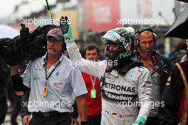 Nico Rosberg (GER) Mercedes AMG F1 celebrates his second position in parc ferme. 05.10.2014. Formula 1 World Championship, Rd 15, Japanese Grand Prix, Suzuka, Japan, Race Day.