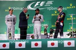 The podium (L to R): Nico Rosberg (GER) Mercedes AMG F1, second; Nigel Mansell (GBR); Lewis Hamilton (GBR) Mercedes AMG F1, race winner; Sebastian Vettel (GER) Red Bull Racing, third. 05.10.2014. Formula 1 World Championship, Rd 15, Japanese Grand Prix, Suzuka, Japan, Race Day.