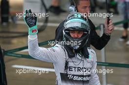 Nico Rosberg (GER) Mercedes AMG F1 celebrates his second position in parc ferme. 05.10.2014. Formula 1 World Championship, Rd 15, Japanese Grand Prix, Suzuka, Japan, Race Day.