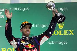 Sebastian Vettel (GER) Red Bull Racing celebrates his third position on the podium. 05.10.2014. Formula 1 World Championship, Rd 15, Japanese Grand Prix, Suzuka, Japan, Race Day.