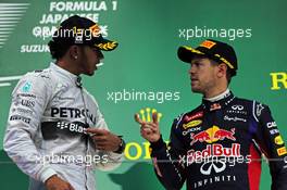 (L to R): Race winner Lewis Hamilton (GBR) Mercedes AMG F1 on the podium with third placed Sebastian Vettel (GER) Red Bull Racing. 05.10.2014. Formula 1 World Championship, Rd 15, Japanese Grand Prix, Suzuka, Japan, Race Day.