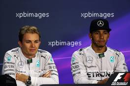 (L to R): Nico Rosberg (GER) Mercedes AMG F1 and team mate Lewis Hamilton (GBR) Mercedes AMG F1 in the FIA Press Conference. 05.10.2014. Formula 1 World Championship, Rd 15, Japanese Grand Prix, Suzuka, Japan, Race Day.
