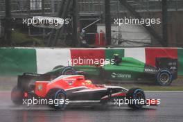 Marcus Ericsson (SWE) Caterham CT05 spins off and is passed by Jules Bianchi (FRA) Marussia F1 Team MR03. 05.10.2014. Formula 1 World Championship, Rd 15, Japanese Grand Prix, Suzuka, Japan, Race Day.