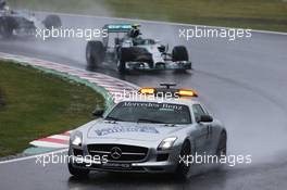 Nico Rosberg (GER) Mercedes AMG F1 W05 leads behind the FIA Safety Car. 05.10.2014. Formula 1 World Championship, Rd 15, Japanese Grand Prix, Suzuka, Japan, Race Day.