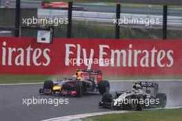 Kevin Magnussen (DEN) McLaren MP4-29 and Daniel Ricciardo (AUS) Red Bull Racing RB10. 05.10.2014. Formula 1 World Championship, Rd 15, Japanese Grand Prix, Suzuka, Japan, Race Day.