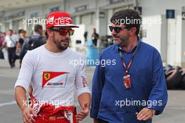 (L to R): Fernando Alonso (ESP) Ferrari with Luis Garcia Abad (ESP) Driver Manager. 04.10.2014. Formula 1 World Championship, Rd 15, Japanese Grand Prix, Suzuka, Japan, Qualifying Day.