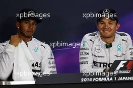 (L to R): Lewis Hamilton (GBR) Mercedes AMG F1 and team mate Nico Rosberg (GER) Mercedes AMG F1 in the FIA Press Conference. 04.10.2014. Formula 1 World Championship, Rd 15, Japanese Grand Prix, Suzuka, Japan, Qualifying Day.
