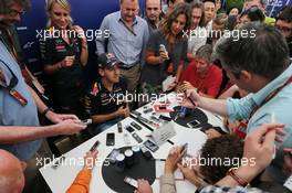 Sebastian Vettel (GER) Red Bull Racing with the media. 04.10.2014. Formula 1 World Championship, Rd 15, Japanese Grand Prix, Suzuka, Japan, Qualifying Day.