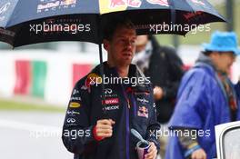 Sebastian Vettel (GER) Red Bull Racing on the drivers parade. 05.10.2014. Formula 1 World Championship, Rd 15, Japanese Grand Prix, Suzuka, Japan, Race Day.